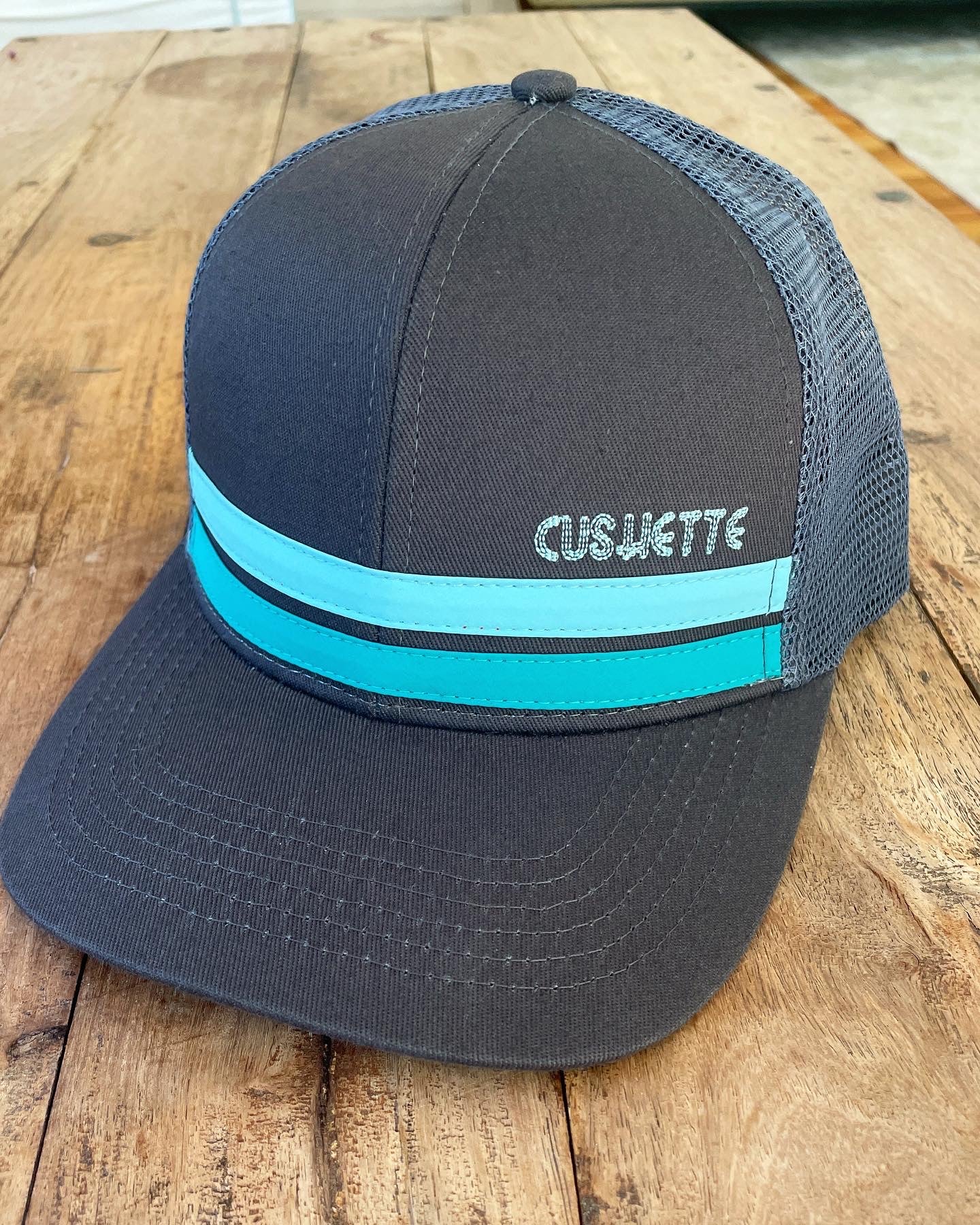 Dark grey/turquoise stripe meshback hat