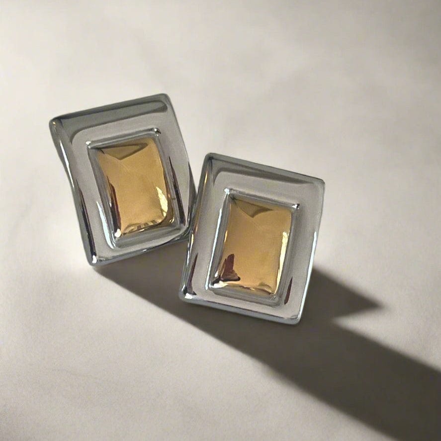 Mixed metal geometric statement earring.
