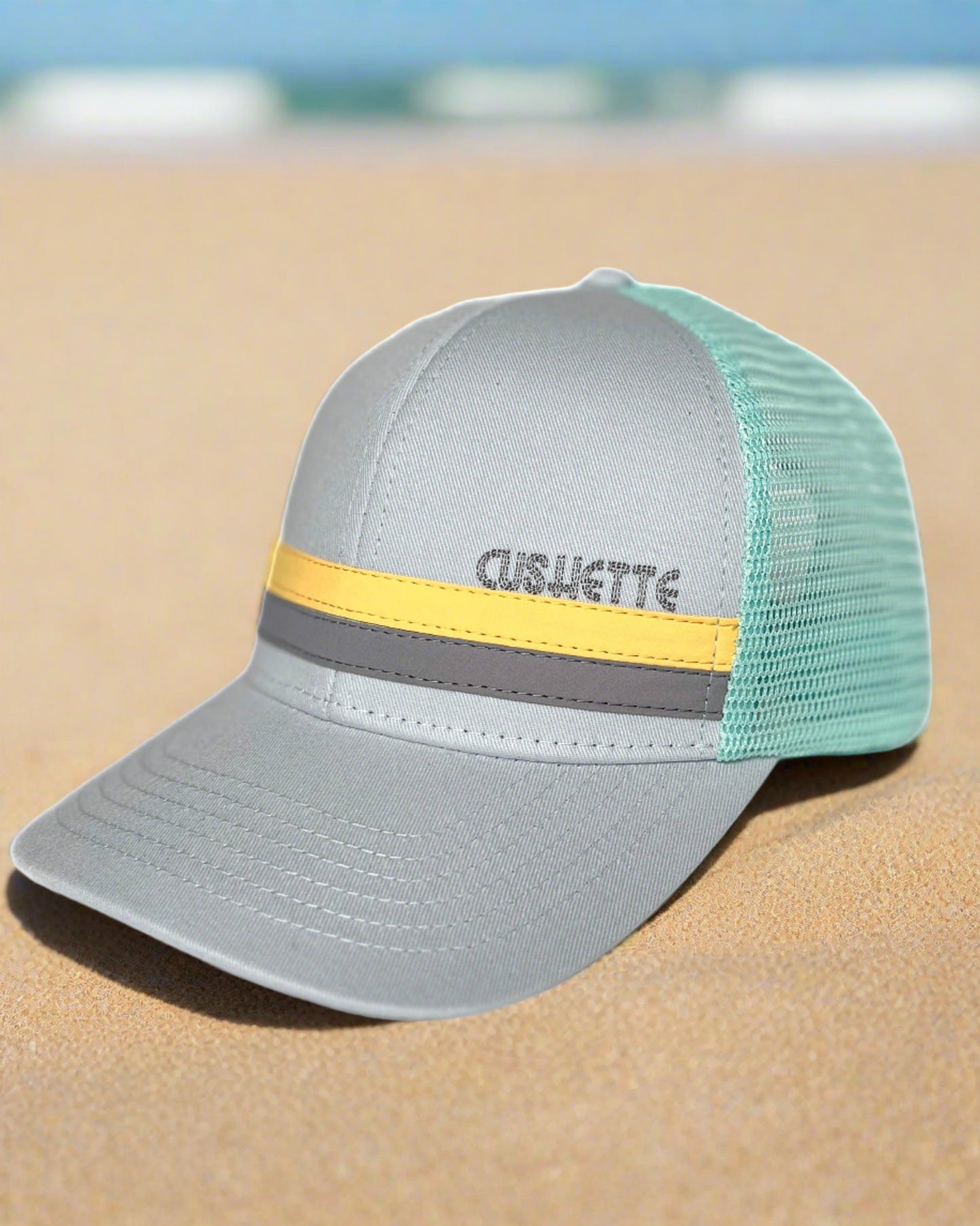 Gray and turquoise trucker hat
